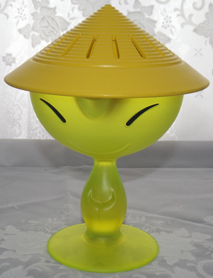 Yellow Alessi 'Mandarin' juicer showing the hat