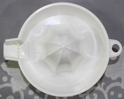 Top view of a White BIPA plastic 1 piece juicer