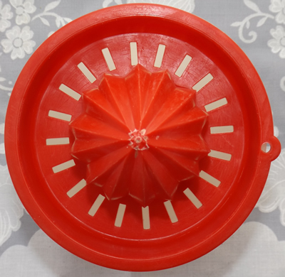 The red reamer for Tupperware bowl