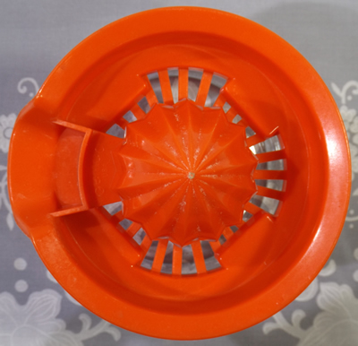Orange Gemco plastic juicer top