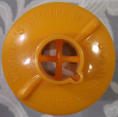 Showing embossing on Orange WORLD'S SMALLEST JUICE EXTRACTOR juicer