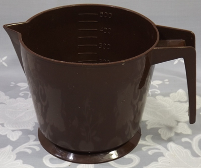 Brown and cream HOSTESS BRAND measuring jug
