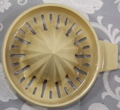 Brown and cream HOSTESS BRAND juicer