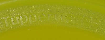 Branding on a yellow Tupperware funnel juicer