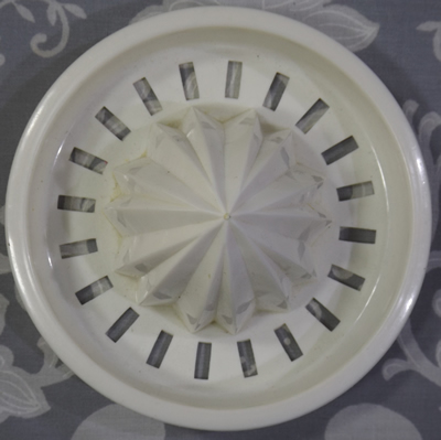 Pale green and white plastic 2 piece reamer