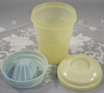 3 parts of a cream and blue Ferolux Gyro Mixer plastic juicer
