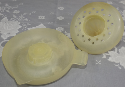 Parts of Australian translucent cream plastic 2 piece juicer