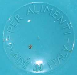 Base of a blue and white 3 piece plastic squeezer juicer