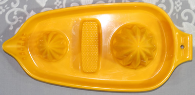 Top view of a light orange Hutzler plastic juicer