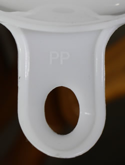 Embossed "PP" on a double pouring spout white plastic juicer