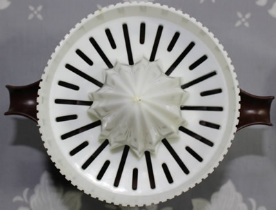 Top view of a dark brown Decor juicer with white top