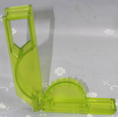An open Zyliss transparent lime green plastic bird squeezer juicer