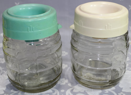2 colours of plastic juicer on glass jar 