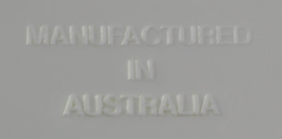 Embossed base of a Vital 3 piece white and grey hand press juicer