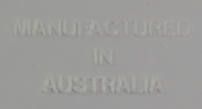 Embossed base of a Vital 3 piece white, maroon and grey hand press juicer