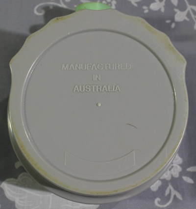 Base of an Australian red and grey 3 piece plastic juicer