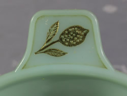 Embossed gold lemon on a pale green plastic Associated Plastics juicer