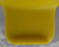 Yellow hard plastic juicer embossed tab grip