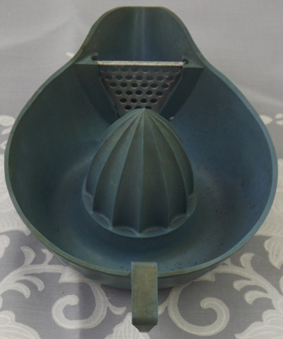 Blue bakelite juicer showing strainer
