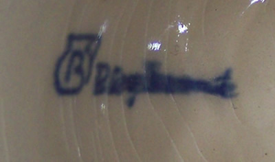 Potter's mark on cobalt blue on white with white spots pottery juicer