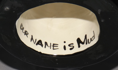 "Our Name Is Mud" on a skyscape pottery juicer