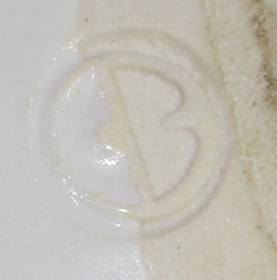 Potters mark on blue trim white pottery juicer