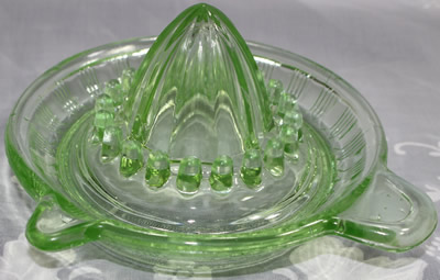 A Crown Crystal Glass Type 4 green glass juicer