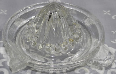 A Crown Crystal Glass Type 8 clear glass juicer