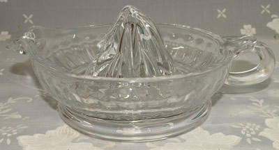 A Morgan and Finch Home Collection glass loop handle juicer