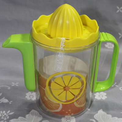A 2 piece plastic watering can juicer