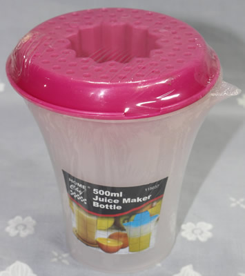 A Home Chef pink plastic juicer on white 'Bottle'