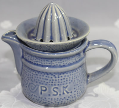 Embossed P.S.K. blue ceramic juicer