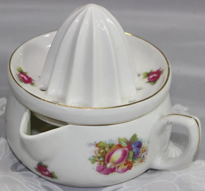 Fruit on white Prussian cup juicer