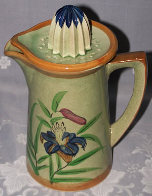 Blue flowers on tall green juicer