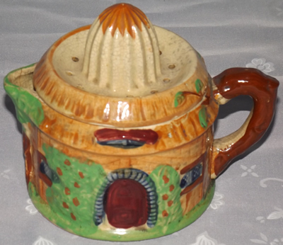 Brown handle red door cottage juicer