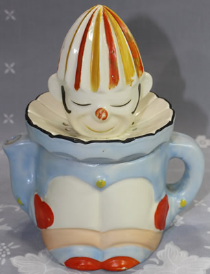 Blue and white with pink, orange and yellow clown juicer