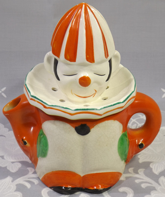 Seiei orange, green and black on white clown juicer