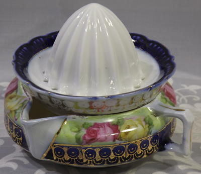 Roses on German juicer with blue and gold gilding juicer