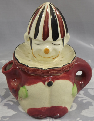 Cream, blue, green and orange on white 7" clown juicer