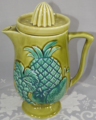 Olive green pitcher with green fruit juicer