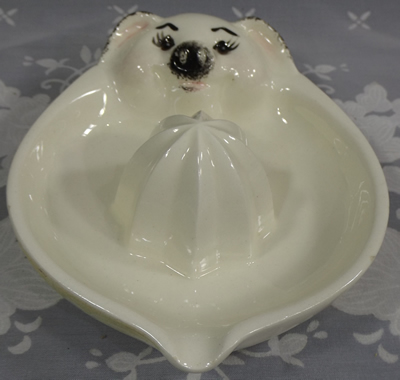 Black on white saucer pig juicer
