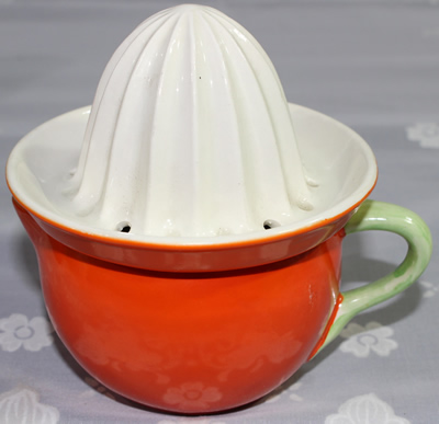 Crown Devon orange and white with green handle 2 piece juicer