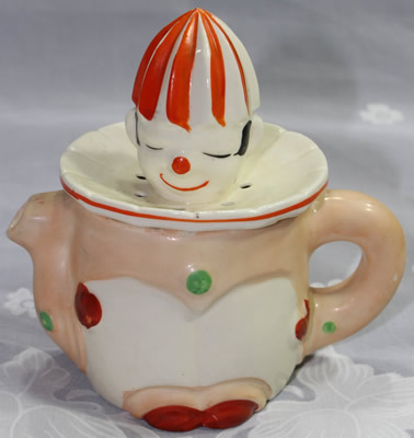 A 4¼" pink, orange and white clown juicer