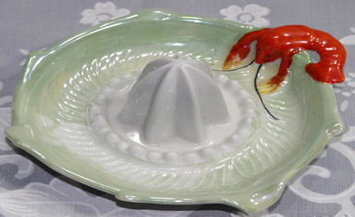 Red lobster on green lustre and white saucer shape juicer