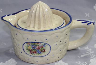 Multicoloured flowers on a cream 2 piece juicer
