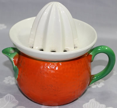 Orange peel, green and white ceramic juicer