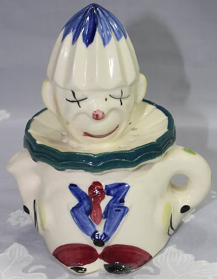 Green polka dots on white crossed eyes clown juicer