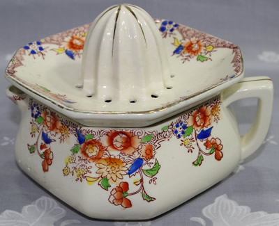 Brown, blue and yellow flowers on an octagonal shape juicer