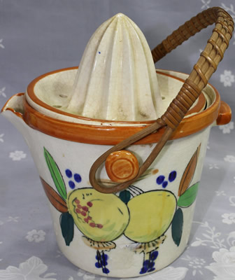 Lemons on a large biscuit barrel with cane handle juicer