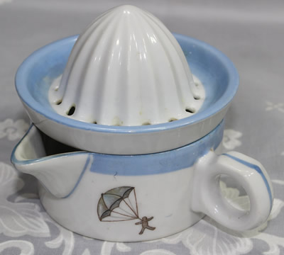 Limoges skater, parachute and aeroplane 2 piece juicer